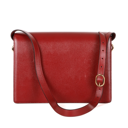 372 - Gucci, a red leather satchel, featuring an adjustable leather shoulder strap, magnetic flap closure ... 