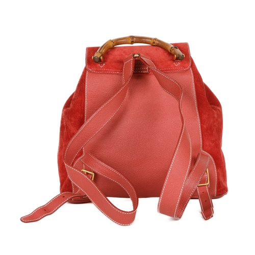 376 - Gucci, a large Bamboo backpack, featuring a red suede exterior with grained red leather trim, curved... 