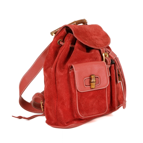 376 - Gucci, a large Bamboo backpack, featuring a red suede exterior with grained red leather trim, curved... 