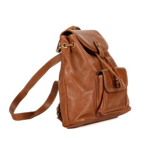 378 - Gucci, a small Bamboo backpack, featuring a smooth tan leather exterior, curved bamboo top handle, f... 