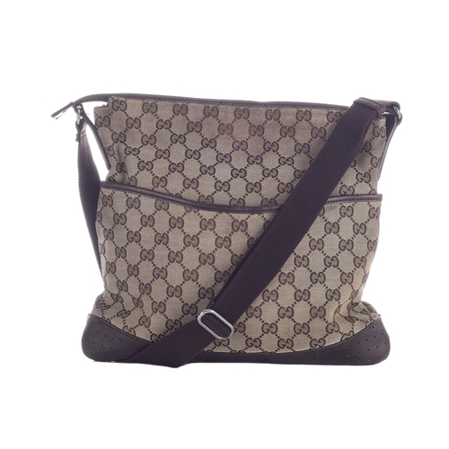 379 - Gucci, a medium messenger bag, designed with the maker's GG monogram canvas exterior with brown leat... 