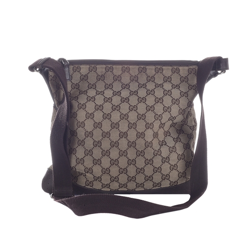 379 - Gucci, a medium messenger bag, designed with the maker's GG monogram canvas exterior with brown leat... 