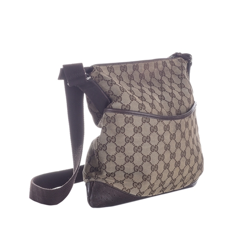 379 - Gucci, a medium messenger bag, designed with the maker's GG monogram canvas exterior with brown leat... 