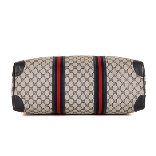 380 - Gucci, a vintage supreme Web travel bag, crafted from the maker's GG coated canvas exterior, with gr... 