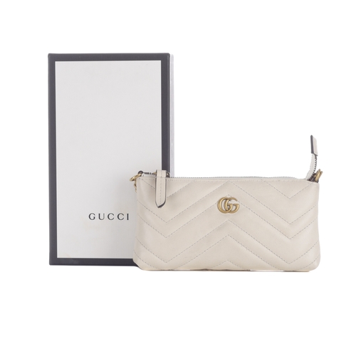 383 - Gucci, a mini Matelasse Marmont chain purse, crafted from chevron-quilted cream leather, with brushe... 