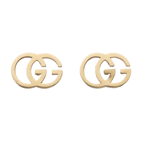 388 - Gucci, a pair of 18ct gold GG stud earrings, signed Gucci, hallmarks for London, length 1.1cm, 2g