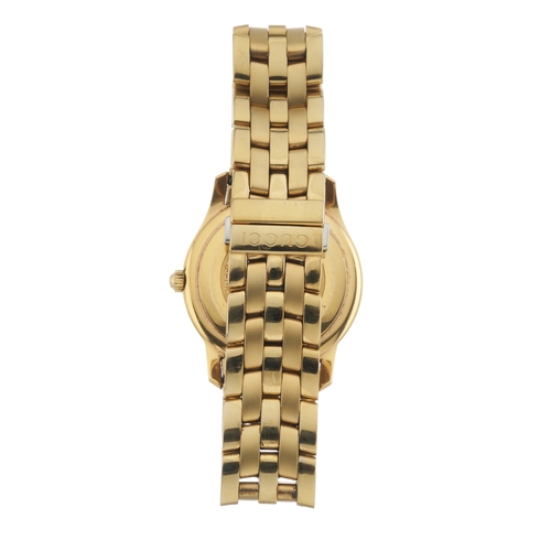 389 - Gucci, a gold plated 5400L bracelet watch, featuring a white dial with black Roman numerals and date... 