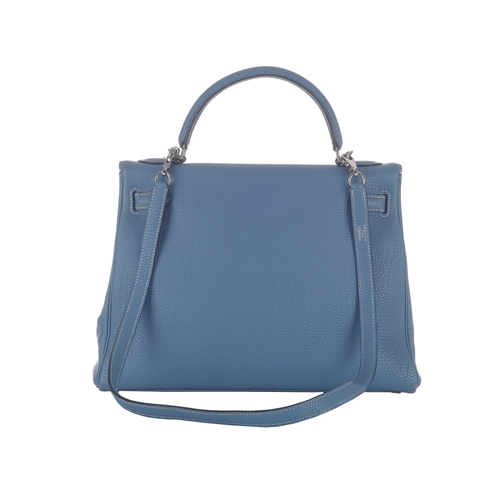 390 - Hermes, a 2003 Bleu Jean Kelly Retourne 32 handbag, crafted from light blue Fjord leather, with pall... 