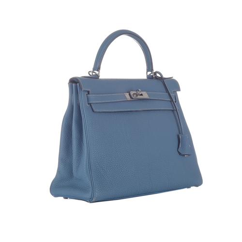 390 - Hermes, a 2003 Bleu Jean Kelly Retourne 32 handbag, crafted from light blue Fjord leather, with pall... 