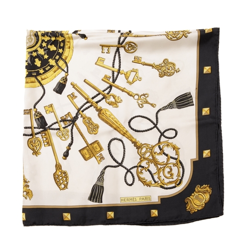 392 - Hermes, a Les Clefs silk scarf, designed by Caty Latham, depicting a circle of ornate gold keys, int... 