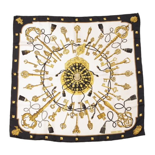 392 - Hermes, a Les Clefs silk scarf, designed by Caty Latham, depicting a circle of ornate gold keys, int... 