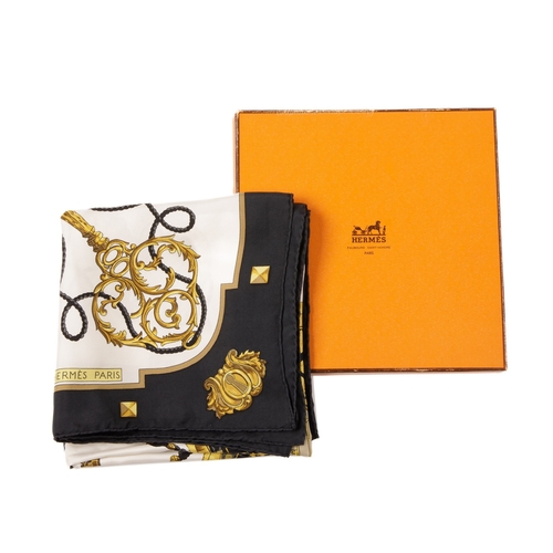 392 - Hermes, a Les Clefs silk scarf, designed by Caty Latham, depicting a circle of ornate gold keys, int... 