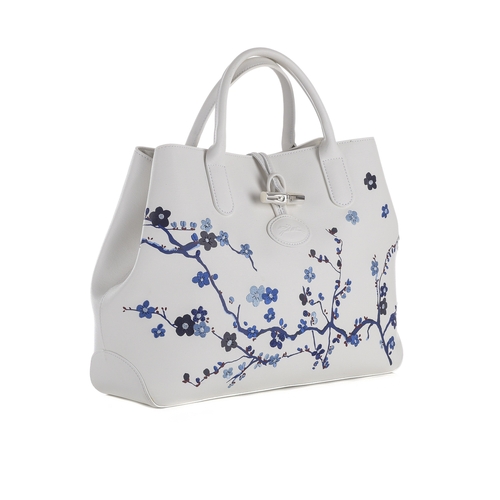 403 - Longchamp, a Roseau Sakura floral handbag, designed with a white coated canvas exterior, featuring b... 