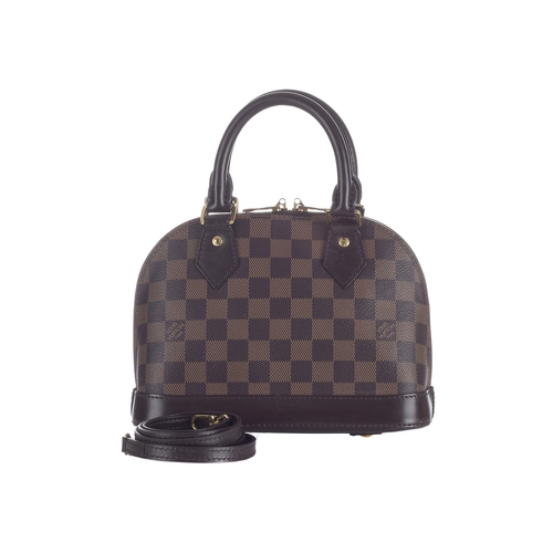 412 - Louis Vuitton, a damier Alma BB handbag, designed with a damier coated canvas exterior and smooth br... 