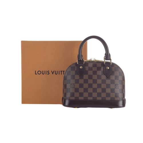 412 - Louis Vuitton, a damier Alma BB handbag, designed with a damier coated canvas exterior and smooth br... 