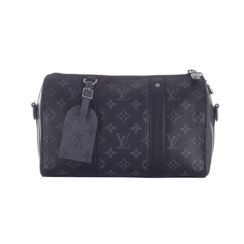 416 - Louis Vuitton, a monogram eclipse reverse Keepall Bandouliere 25 bag, crafted from the maker's monog... 