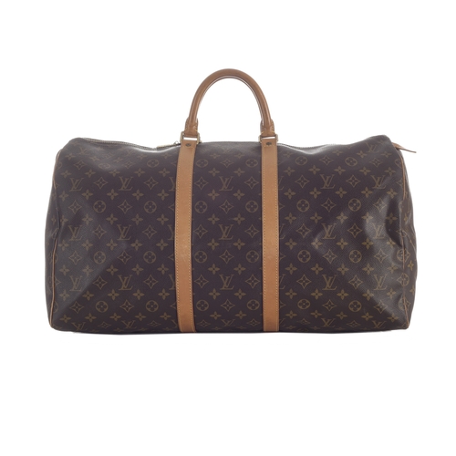 418 - Louis Vuitton, a monogram Keepall 55 luggage bag, featuring the maker's classic monogram coated canv... 