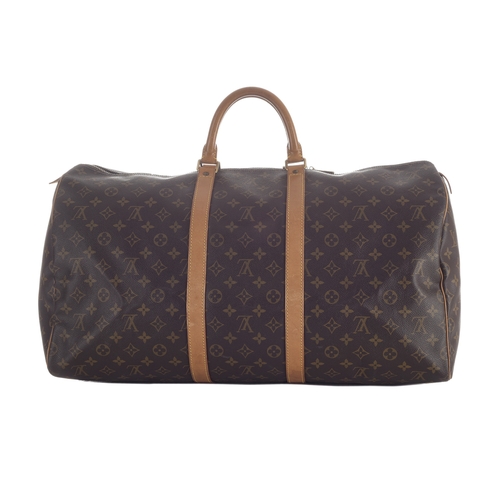 418 - Louis Vuitton, a monogram Keepall 55 luggage bag, featuring the maker's classic monogram coated canv... 