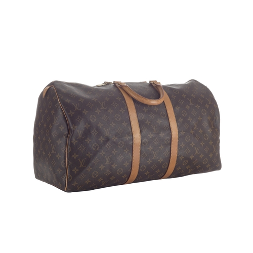 418 - Louis Vuitton, a monogram Keepall 55 luggage bag, featuring the maker's classic monogram coated canv... 