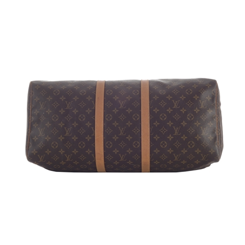 418 - Louis Vuitton, a monogram Keepall 55 luggage bag, featuring the maker's classic monogram coated canv... 