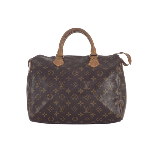 429 - Louis Vuitton, a monogram Speedy 30 handbag, designed with a monogram coated canvas exterior, two va... 