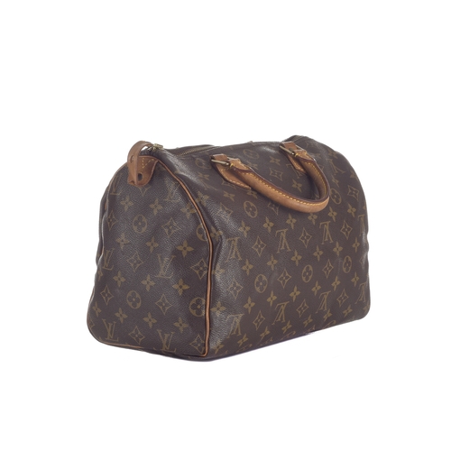 429 - Louis Vuitton, a monogram Speedy 30 handbag, designed with a monogram coated canvas exterior, two va... 