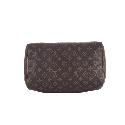 429 - Louis Vuitton, a monogram Speedy 30 handbag, designed with a monogram coated canvas exterior, two va... 