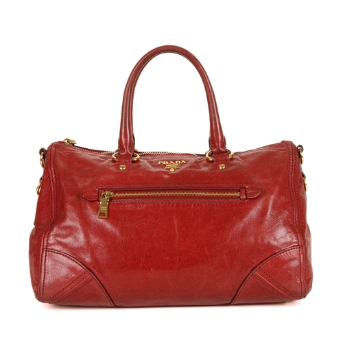 462 - Prada, a red Vitello Shine handbag, featuring a glossy red leather exterior, with gold-tone hardware... 