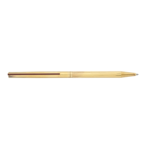 479 - S T Dupont, a Classique vermeil ballpoint pen, fluted barrel with silver gilt cap and red laque de C... 