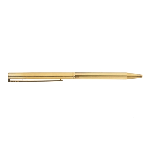 479 - S T Dupont, a Classique vermeil ballpoint pen, fluted barrel with silver gilt cap and red laque de C... 