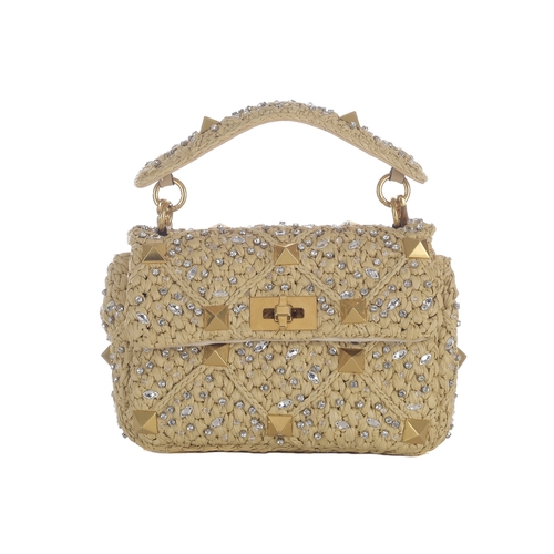 482 - Valentino, a beige Raffia Roman Stud Embellished handbag, featuring a woven raffia exterior with cry... 