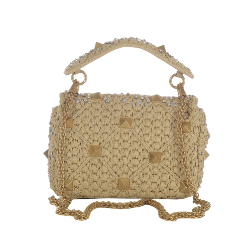 482 - Valentino, a beige Raffia Roman Stud Embellished handbag, featuring a woven raffia exterior with cry... 