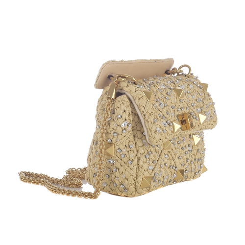 482 - Valentino, a beige Raffia Roman Stud Embellished handbag, featuring a woven raffia exterior with cry... 