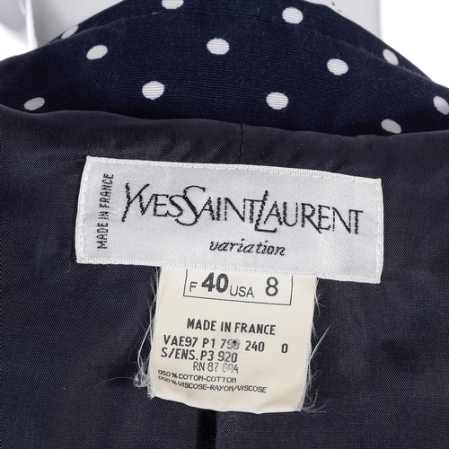 488 - Yves Saint Laurent, a navy blue and white polka dot skirt suit, comprising a fitted jacket with fron... 