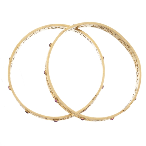 49 - Two gold foliate openwork bangle bracelets, with pink paste cabochon highlights, inner diameter 5.3c... 