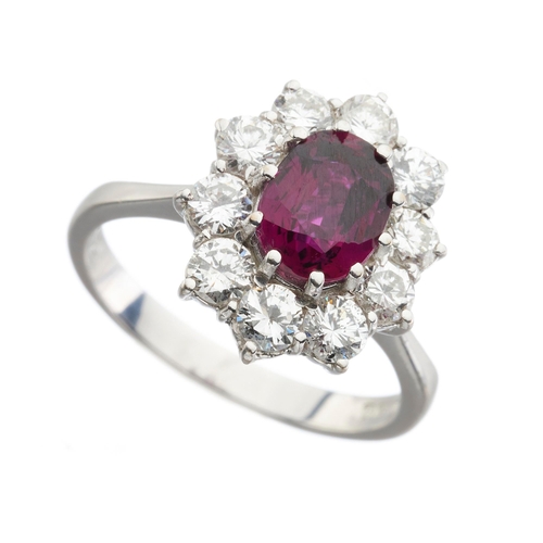 50 - An 18ct gold oval-shape ruby and brilliant-cut diamond cluster ring, ruby estimated weight 1.20ct, e... 