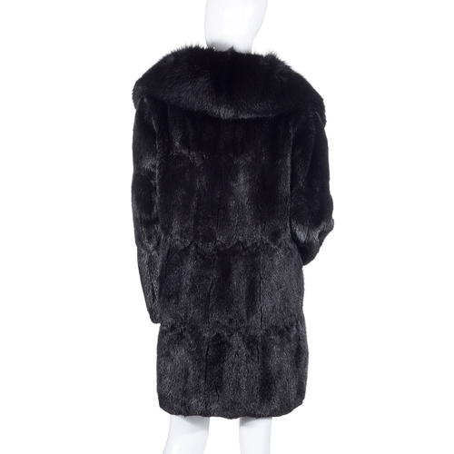 513 - A black musquash fur coat with fox fur collar, designed with a notched lapel fox fur collar, hook an... 