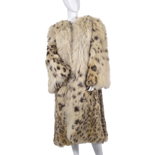 517 - A 1930s real snow leopard fur coat, calf length with wide bell sleeves and an open front, labelled d... 