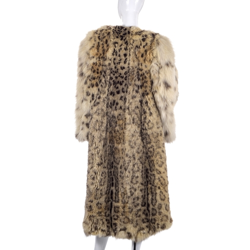 517 - A 1930s real snow leopard fur coat, calf length with wide bell sleeves and an open front, labelled d... 