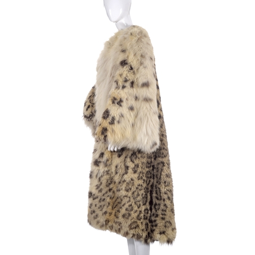 517 - A 1930s real snow leopard fur coat, calf length with wide bell sleeves and an open front, labelled d... 