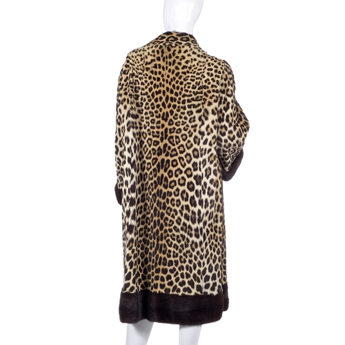 518 - Calman Links, a 1950s leopard fur coat with mink fur trim, designed with a short Mandarin collar, ra... 