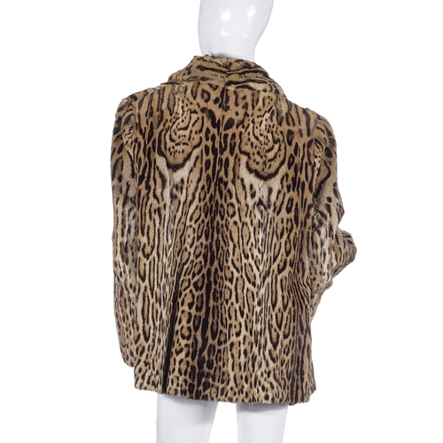 519 - Schwartz, a 1940s ocelot fur jacket, featuring a lapel collar, two hook and eye front fastenings, tw... 