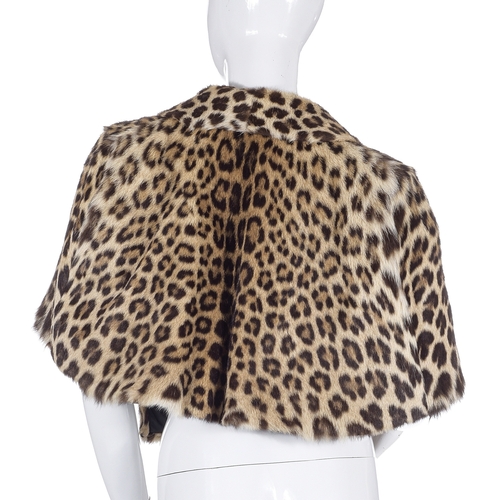 520 - A 1960s leopard fur cape, with a long-panelled collar and wide lapel that provides pocket features, ... 