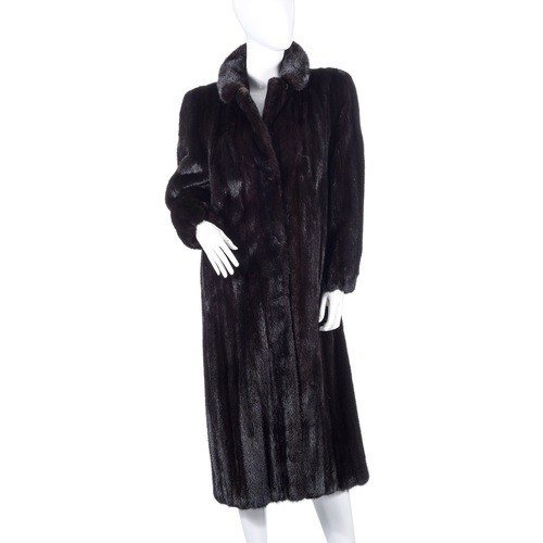 521 - Revillon, a full-length dark ranch mink coat, fully stranded, featuring a notched lapel collar, hook... 