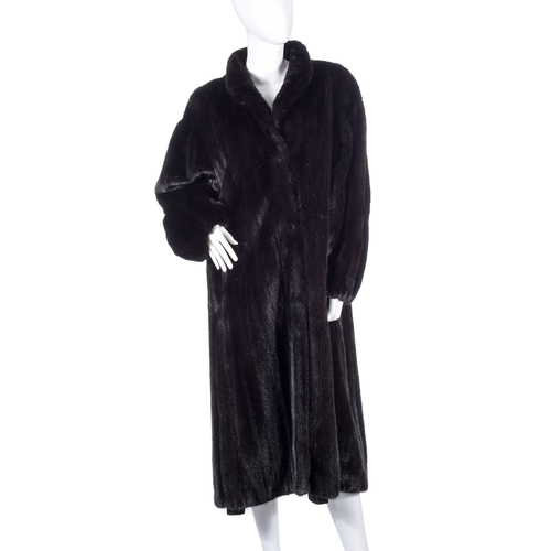 525 - London Label, a full-length dark ranch mink coat, fully stranded, featuring a lapel collar, hook and... 