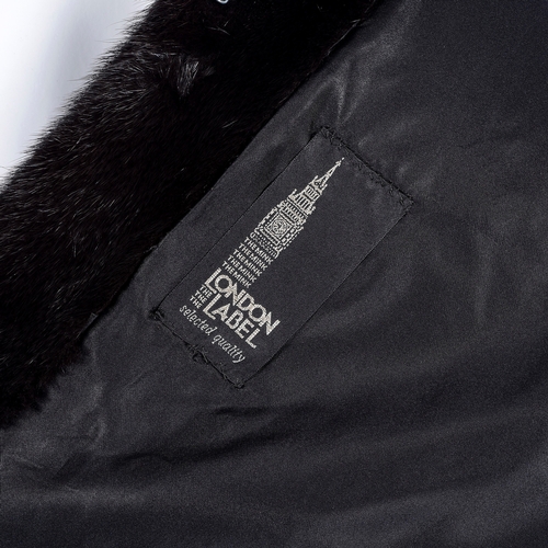 525 - London Label, a full-length dark ranch mink coat, fully stranded, featuring a lapel collar, hook and... 