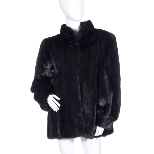 528 - Grosvenor, a three-quarter length black mink jacket, designed with a Mandarin collar, hook and eye c... 