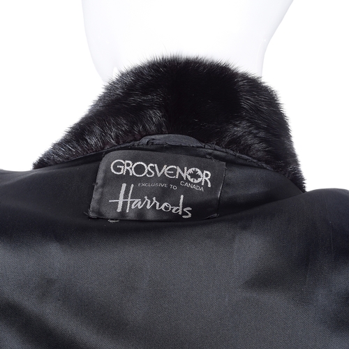 528 - Grosvenor, a three-quarter length black mink jacket, designed with a Mandarin collar, hook and eye c... 