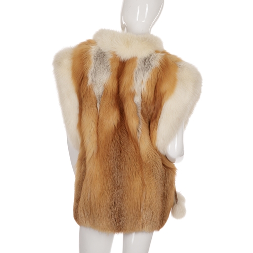 530 - A golden and white fox fur gilet, featuring hook and eye clip fastenings, two outer pockets and two ... 