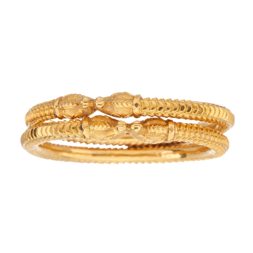 54 - Two 18ct gold double zoomorphic dog bangles, each designed as a stylised fish, inner diameter 5.8cm,... 